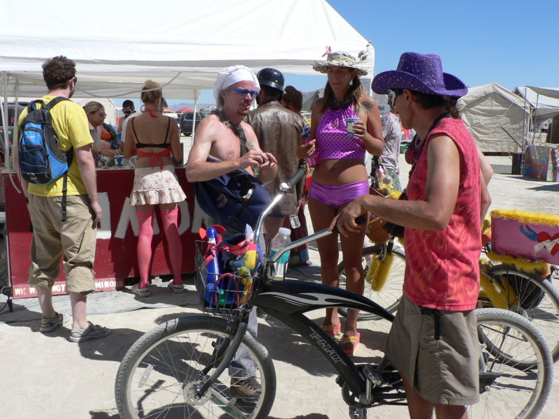 Burning Man has lots of bikes, costumes and color