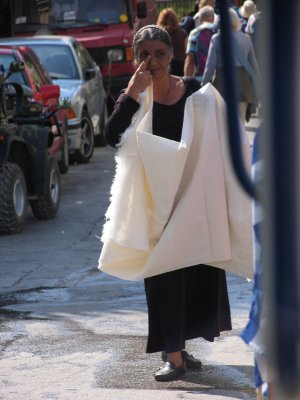Greek Lady selling table cloths Plaka