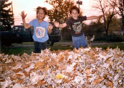 Michael & Aaron jumping into the leaves