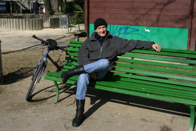 Man Relaxing on Bench