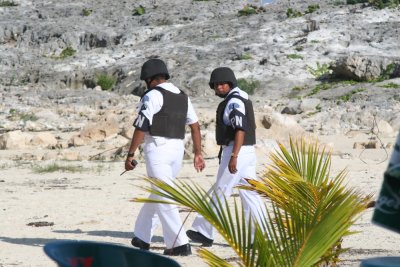 Beach Patrol- note bulletproof vests to protect against dangerous topless nude sunbathers and other forms of nudity