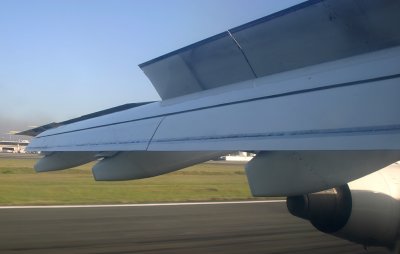 Spoilers, flaps and no reverse thrust.  Quiet landing!