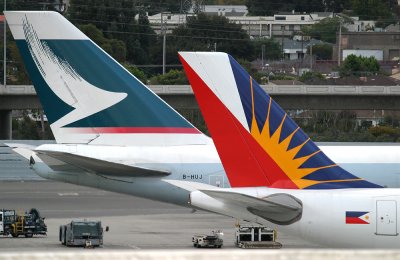 Parked at International Terminal A gate 7 with Cathay Pacific 747  B-HUJ