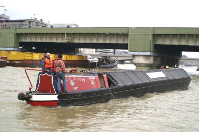 Being passed by rubbish barges by Cannon Street Railway bridge on return journey