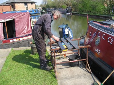 Graham dilling the last of the ballast still to be painted