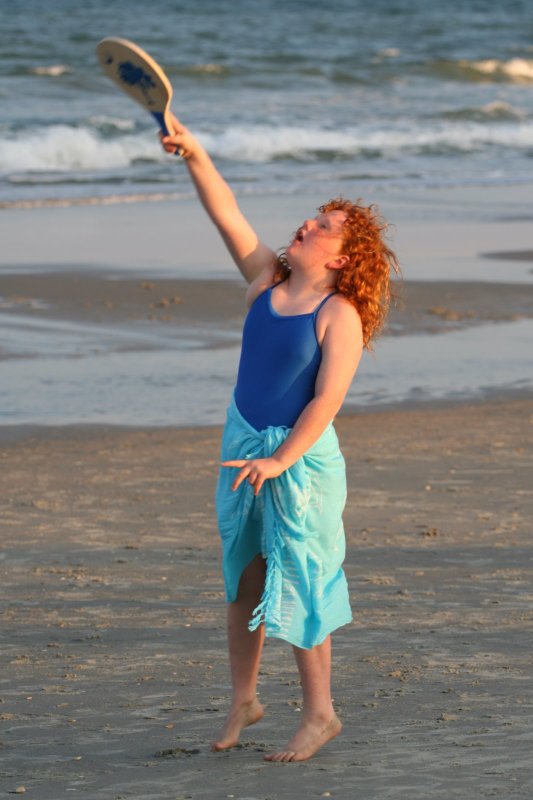 Claire playing paddleball