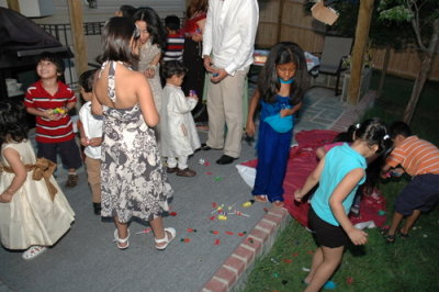 Picking toys and candys from the pinata