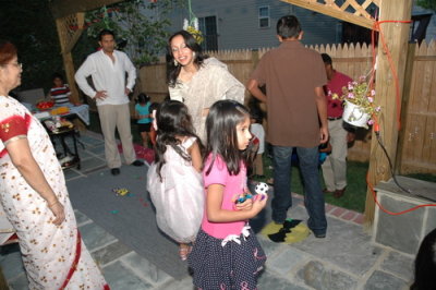Zahra is holding her goodies from the Pinata