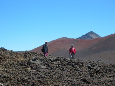 Hikers against red sand