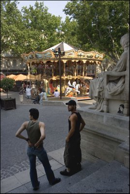 Two young men, carousel, Avignon, France