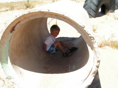 Camera-shy Evan enjoyed showing us his school.JPG