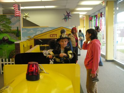 Evan had a great time in the fire truck.JPG
