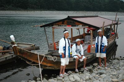 The tour boat with its crew, where tourists may watch the fishing procedure while dining ayu ( sweetfish)
