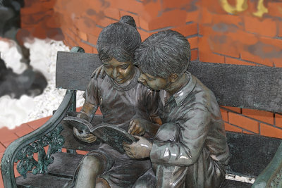 boy and girl on bench...