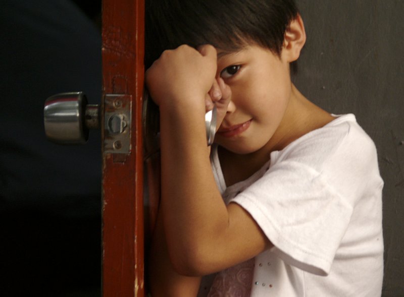 Shy child, Beijing, China, 2007
