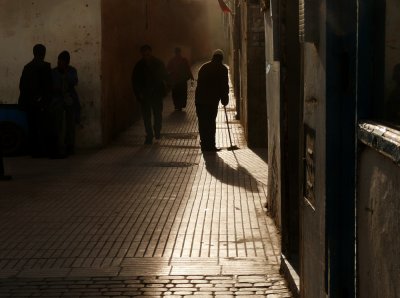 Sweeping shopkeeper, Essaouira, Morocco, 2006