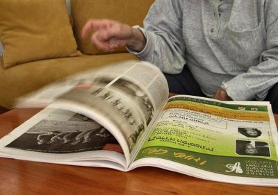 Leafing Through The Paper.JPG