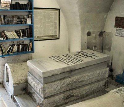 Prayer Books Are Placed In A Bookcase Beside The Rabbis Grave, For Visitors Use.JPG