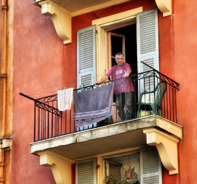 Daily life flows like a quiet river seen from a balcony...