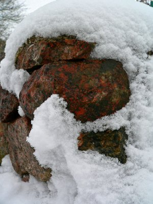 Stonewall with a cap of snow