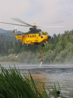 S-61 full of water to spray on Little Grider Fire