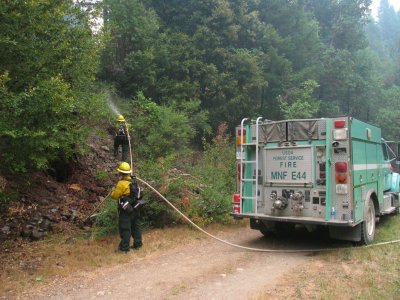 Wetting down the yard before the burn