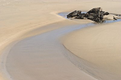 Rock and sand.Deadman's Beach, North Stradbroke Island