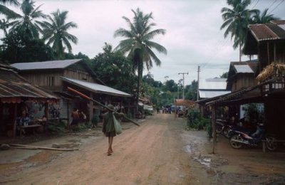 Man Walking Through Village