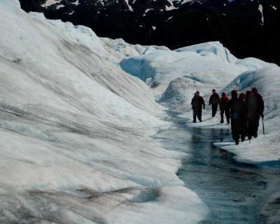 Walking along a stream in the Mendenhall Glacier