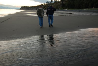 Father and son walking the beach