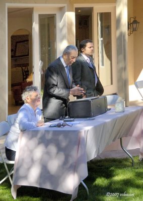 The auctioneer listens for more bids.