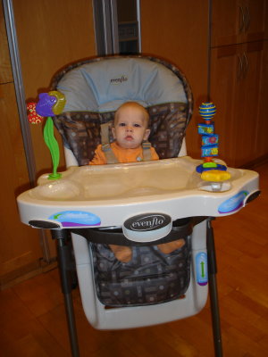 Looking awfully tiny in this highchair!