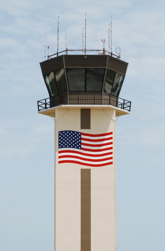 Air traffic control tower with American flag