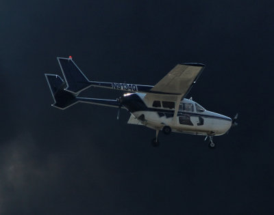 Vietnam era airplane flying through a wall of black smoke