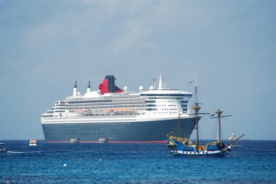 Pirate ship and modern cruise ship