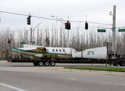 Truck transporting airplane