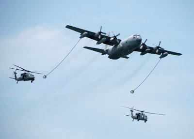 Refueling operation, C-130 and two HH-60G Pave Hawks