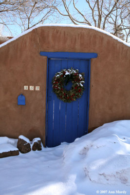 Blue door with wreath