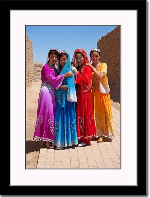 Four Uygur Girls Wearing Colorful Costumes at Ancient City of Gaochang