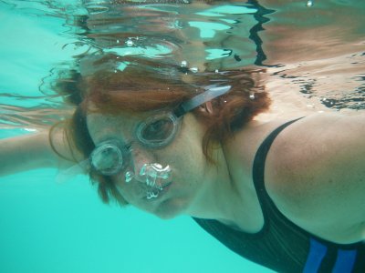 Galina having fun blowing bubbles underwater