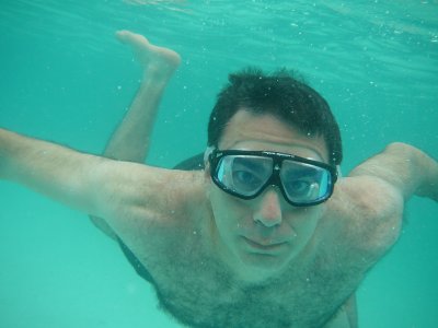 Rich swimming around underwater looking very serious