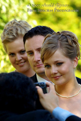 Brides Maids and Best Man being photographed
