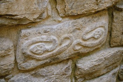 Stone carving with snake motive