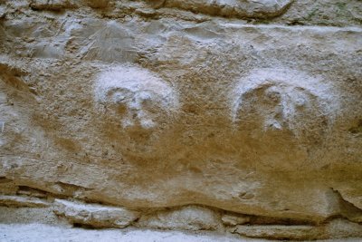 Stone carving showing human faces