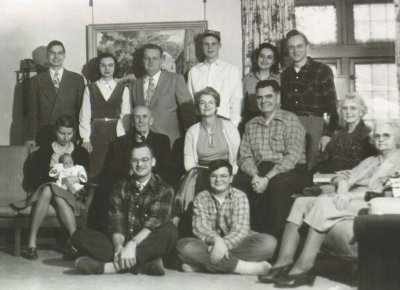 Dad's family (1945).  Tim is seated with legs crossed front and center.