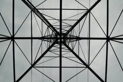 Looking straight up into a power lines tower