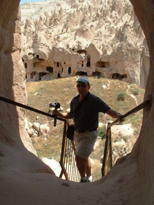 Zelve:  Bob clilmbing into high cave rooms