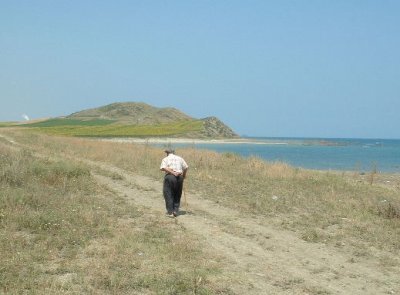 Turkish gentleman walking through the countryside