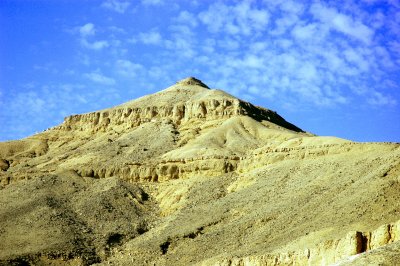 the isolated valley is dominated by the pyramid-shaped mountain of Al-Qurn (The Horn)