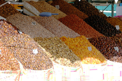 dried fruits and nuts are heaped in baskets